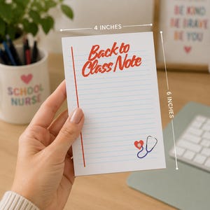 May include: A white rectangular notepad measuring 4 inches by 6 inches with blue horizontal lines and a red vertical margin line. The text Back to Class Note is printed in red at the top, and a small red heart with a stethoscope is at the bottom.