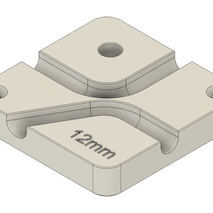 May include: A white plastic 3D printed cable management clip with a 12mm opening. The clip has four holes for mounting.