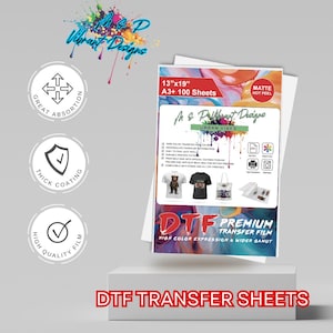 May include: A pack of 100 DTF transfer sheets in A3 size, measuring 13 inches by 19 inches. The sheets are matte and have a hot peel finish. The packaging highlights the features of the sheets, including high-quality film, thick coating, and great absorption. The text "DTF Premium Transfer Film" is printed on the packaging, along with the phrase "High Color Expression & Wider Gamut".