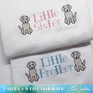 May include: Two white embroidered baby onesies with a yellow Labrador puppy design. The top onesie says "Little Sister" in pink thread. The bottom onesie says "Little Brother" in blue thread.