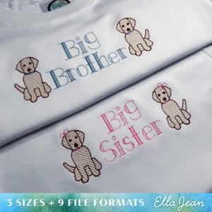 May include: Two white t-shirts with embroidered images of Labrador Retriever puppies. One shirt says "Big Brother" in blue thread and the other says "Big Sister" in pink thread.