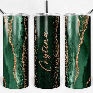 May include: Green and gold glitter tumbler with the name "Christina" written in gold on the side.