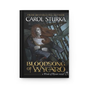 May include: A hardback book titled "Bloodsong of Wygaro" by Carol Sturka. The cover depicts a woman with red hair, wearing a dark coat, against a ship's rigging. The book is part of the "Winds of Wycare" novel series.
