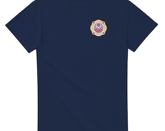 May include: A navy blue t-shirt with a yellow and red firefighter emblem on the left chest. The emblem has a crossed axe and a red heart.