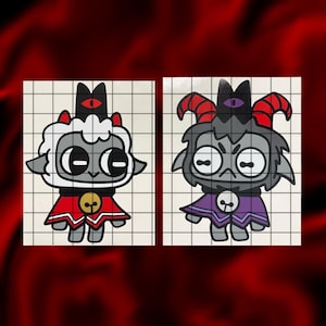 May include: Two cartoon stickers featuring a lamb and a goat, each with a crown and cape. The lamb is white with a red cape and gold bell. The goat is gray with a purple cape and skull emblem. Both have large eyes.