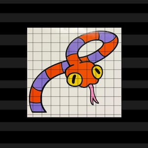 May include: A vinyl sticker featuring a cartoon snake with a segmented body in alternating orange and purple bands. The snake has a large orange head, prominent yellow eyes with black pupils, and a pink forked tongue, all set against a white grid.