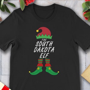 Magliette coordinate divertenti per tutta la famiglia con gli elfi di Natale del Dakota del Sud.