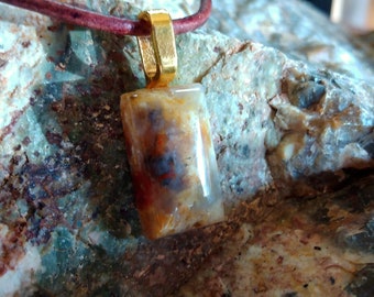 Handmade leather necklace with a beautiful petrified wood pendant