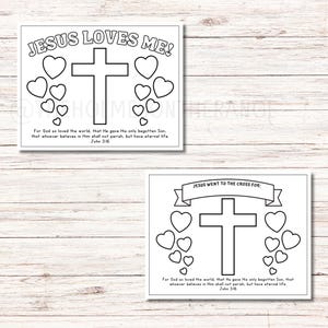 May include: Two white square prints with black outlines. One reads "JESUS LOVES ME!" above a cross and hearts. The other says "JESUS WENT TO THE CROSS FOR:" above a cross and hearts. Both include Bible verses.