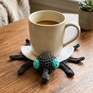 May include: A handmade wooden sign with the text "Welcome to our home" in a handwritten style. The sign is painted white with black lettering and a distressed finish, suitable for indoor or outdoor use.