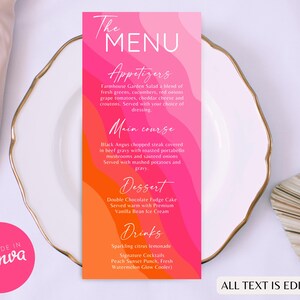 Peut inclure: Une carte de menu avec un design ondulé rose et orange vif, avec le texte "The MENU" en haut. Le menu répertorie les entrées, les plats principaux, le dessert et les boissons. La carte est sur une assiette blanche avec un bord doré, avec le texte "ALL TEXT IS EDITABLE".