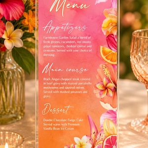 May include: A vertical rectangular acrylic menu sign in a wooden base featuring a pink and orange watercolor background with floral and citrus illustrations. The text lists appetizers, main course, and dessert options with detailed food descriptions.
