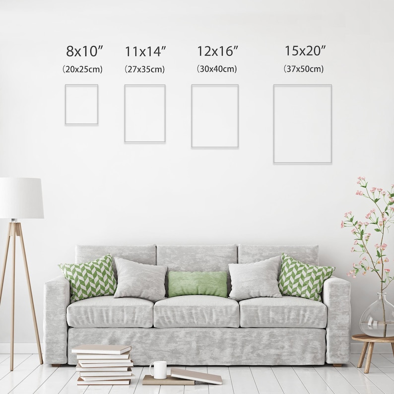 May include: Four framed art prints in various sizes: 8x10 inches (20x25cm), 11x14 inches (27x35cm), 12x16 inches (30x40cm), and 15x20 inches (37x50cm). The prints are displayed on a white wall above a gray sofa with decorative pillows. A floor lamp and side table are also visible.