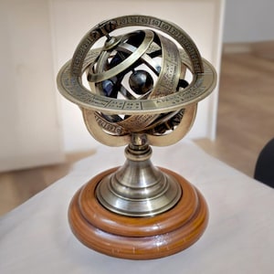 Vintage Brass Armillary Sphere on Elegant Wooden Base: A Nostalgic Décor Accent for Your Home Décor Antique - Inspired Armillary Sphere