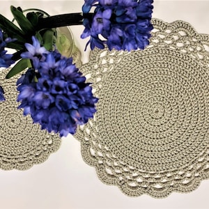 May include: A set of three ceramic mugs with a speckled, matte finish. The mugs are in shades of cream, light gray, and dark gray. Each mug has a simple, minimalist design, perfect for coffee or tea.