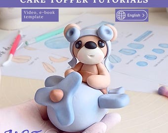 飛行機に乗ったテディベアのケーキトッパーの作り方。動画、電子書籍、テンプレート付き。男の子の1歳の誕生日に。
