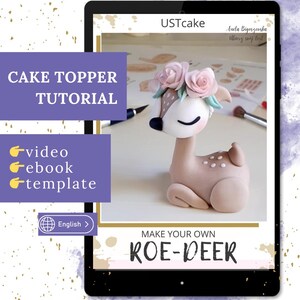 Peut inclure: Tutoriel de décoration de gâteau affiché sur une tablette. Le décor est un cerf brun clair avec un visage blanc, des yeux noirs et une couronne florale. Le texte "CAKE TOPPER TUTORIAL" et "MAKE YOUR OWN ROE-DEER" sont visibles.