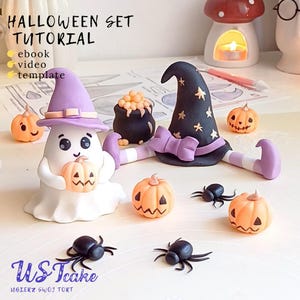 May include: A Halloween-themed set featuring a ghost, witch hat, pumpkins, spiders, and a cauldron. The ghost wears a purple hat and holds a pumpkin. The witch hat is black with gold stars and a purple bow. The pumpkins are orange with carved faces.