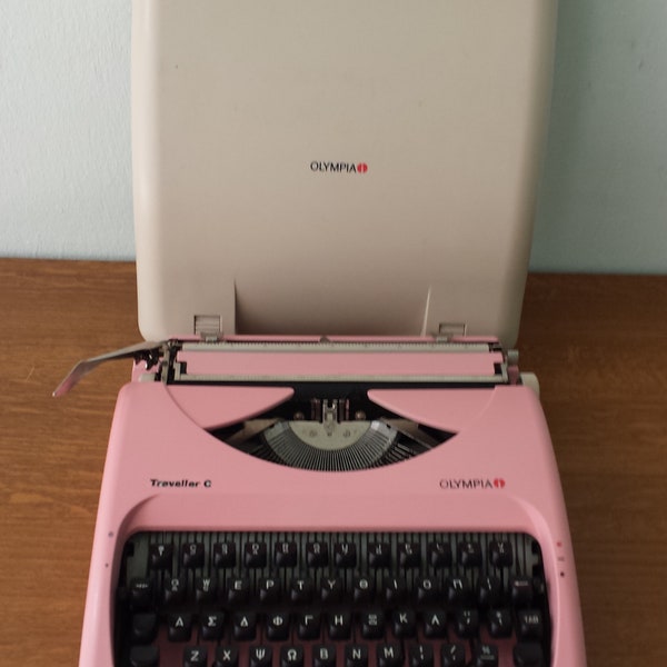 Typewriter, portable manual with pink carrying case, Works well, all colors, available,