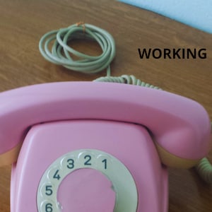 1Pink vintage retro telephone, pink dial telephone, pink telephone, landline telephone, Bakelite telephone, desk telephone.