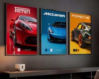 May include: Three framed automotive art prints featuring a red Ferrari, a blue McLaren, and a green Porsche. Each print has the car's name in white text at the top and a color palette at the bottom. The Ferrari print is on a red background.