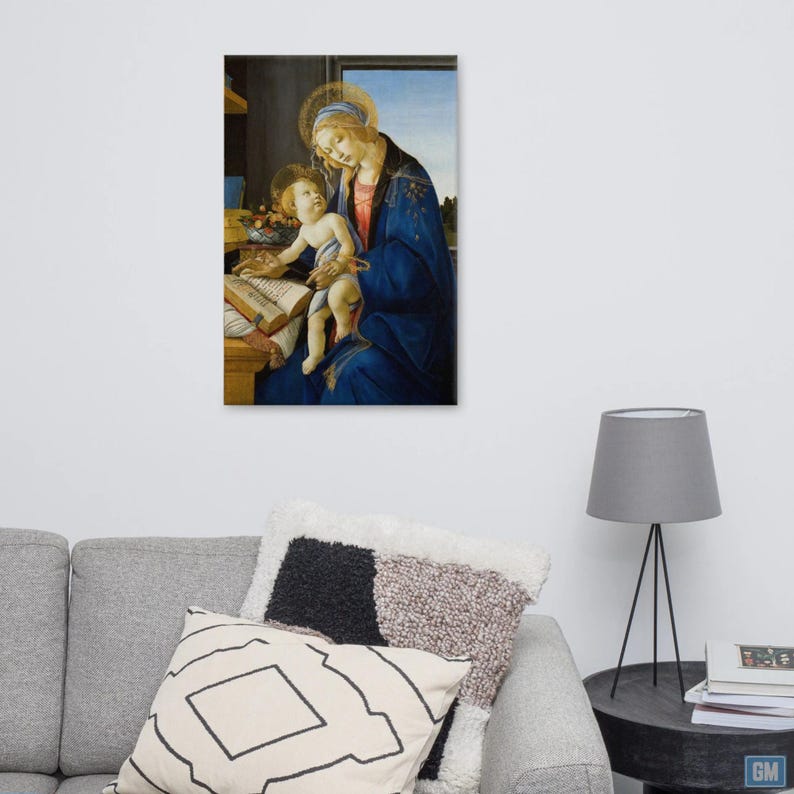 The intimate depiction of the Madonna lovingly holding her child on her lap as she reads a sacred book symbolizes wisdom and divine knowledge and conveys a sense of serenity and spirituality.