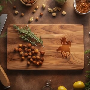 May include: A rectangular wooden cutting board with a laser-etched silhouette of a person riding a horse. The board is surrounded by ingredients like nuts, herbs, and spices. The wood grain is visible, and the board is approximately 12 inches long.