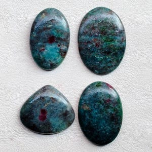 May include: A handmade wooden sign with the text "Welcome" in a playful font. The sign features a distressed finish and a simple, rustic design, perfect for a front door or entryway. The sign is approximately 12 inches wide.