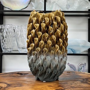 Sculptural ceramic vase with floral texture, brown-grey, handmade statement piece, organic art decor, modern ceramic vessel