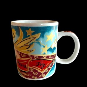May include: White ceramic mug with a blue, teal, and gold design featuring a flying angel with a banner that reads "Peaceful Joy".