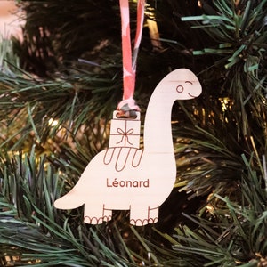 Personalized wooden “Diplodocus” tree ornament engraved with the first name to hang with the festive tree decorations