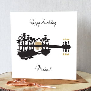 Personalised guitar birthday card. Sunset guitar illusion with balloons. Any name. Suitable any age. Unique card.