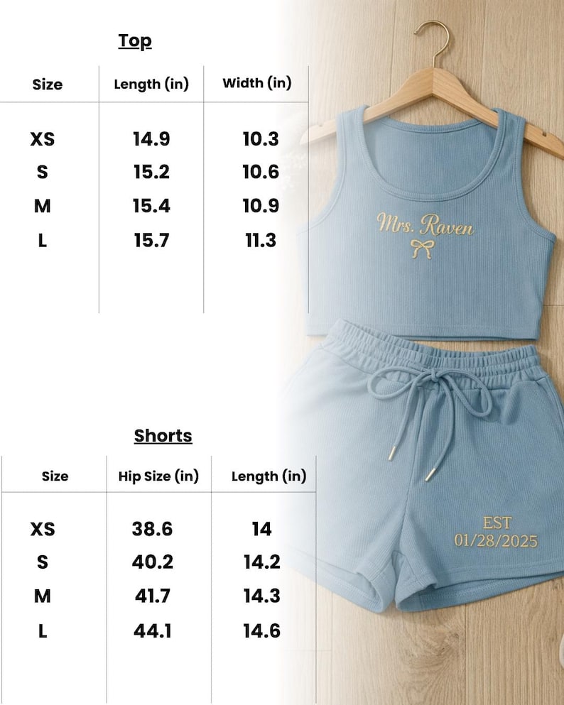 May include: Light blue two-piece lounge set with a ribbed texture. The top is a crop tank with "Mrs. Raven" embroidered in gold. The shorts have a drawstring waist and the date "01/28/2025" embroidered in gold. Size chart included.