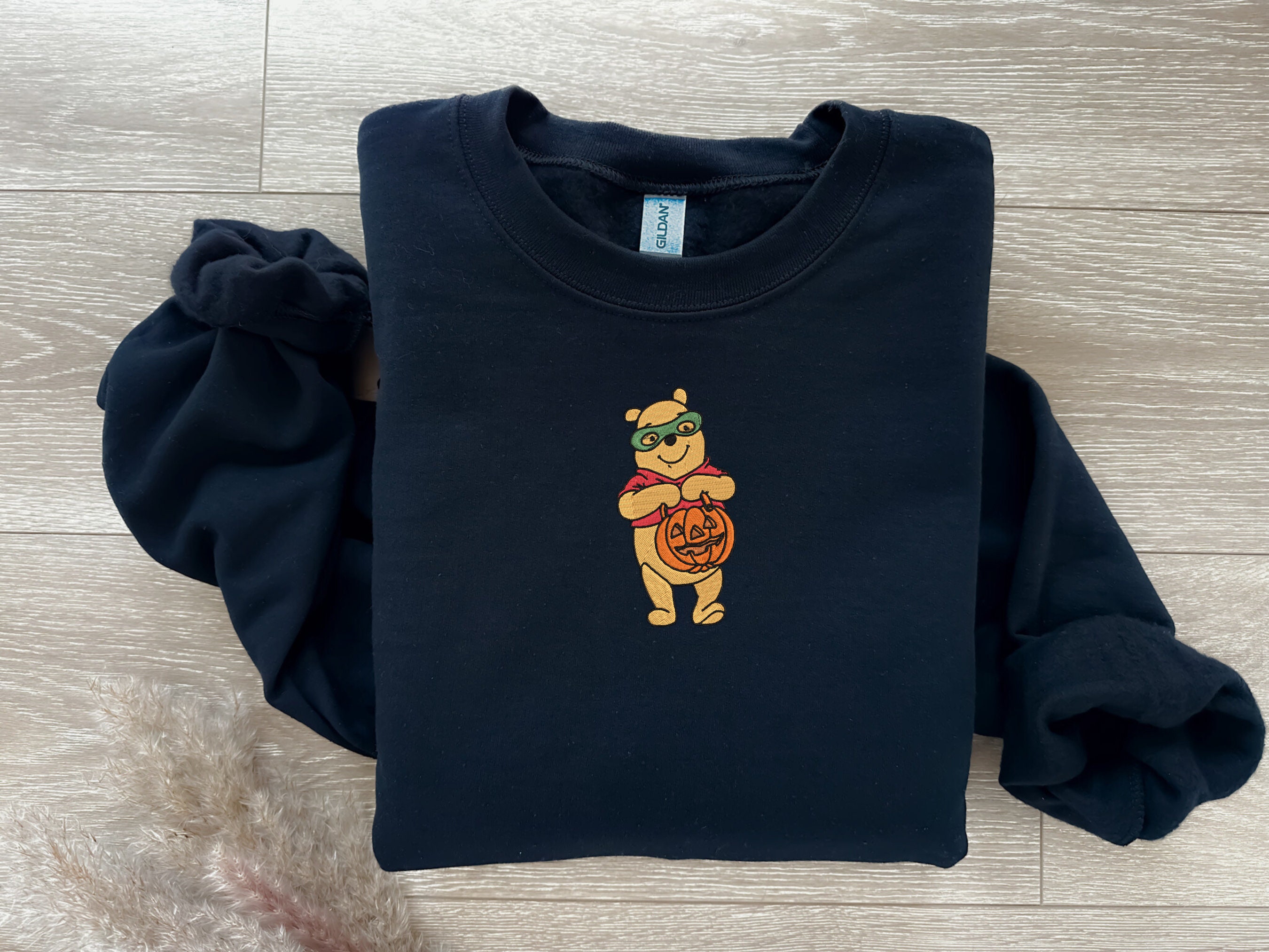 Discover EMBROIDERED Halloween Winnie the Pooh Sweatshirt, Fall Theme Crewneck, Custom Sweatshirt, Fall Sweater, Pumpkin Sweater, Super Hero Shirt