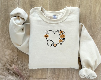 Sudadera de enfermera bordada de Halloween, suéter de estetoscopio espeluznante