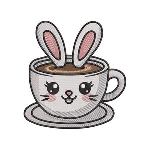 May include: An embroidered design of a coffee cup with bunny ears. The cup is white with a cute bunny face and a saucer. The coffee inside the cup is brown. The bunny ears are white with pink insides.