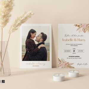 May include: Wedding invitation suite featuring a photograph of a couple and a floral design. The invitation includes the names Izabelle & Harry, wedding date, time, and venue. The design incorporates dried flowers and pampas grass, with two white candles in the foreground.