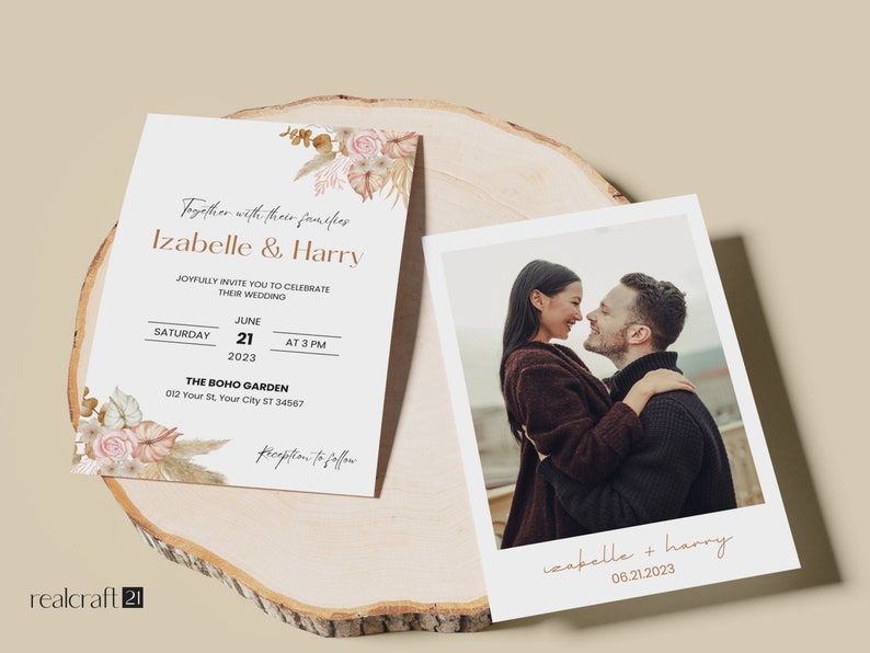 May include: Wedding invitation and photo card set. The invitation features the names "Izabelle & Harry" with floral accents and event details. The photo card shows a couple embracing. Both are on a wooden surface.