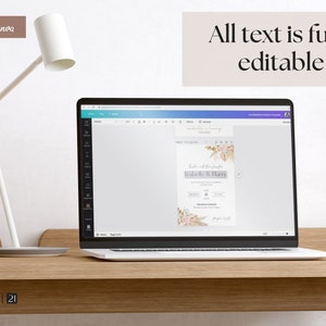May include: A laptop displaying a wedding invitation template with floral accents and the text "Izabelle & Harry." The screen also shows the text "All text is fully editable." A white desk lamp and a gray mug are also visible.