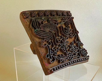 An antique hand carved block print