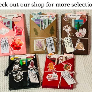 Blind date with a book assortment including pink, brown, cottagecore dark brown, spooky black, and Christmas red wrapping