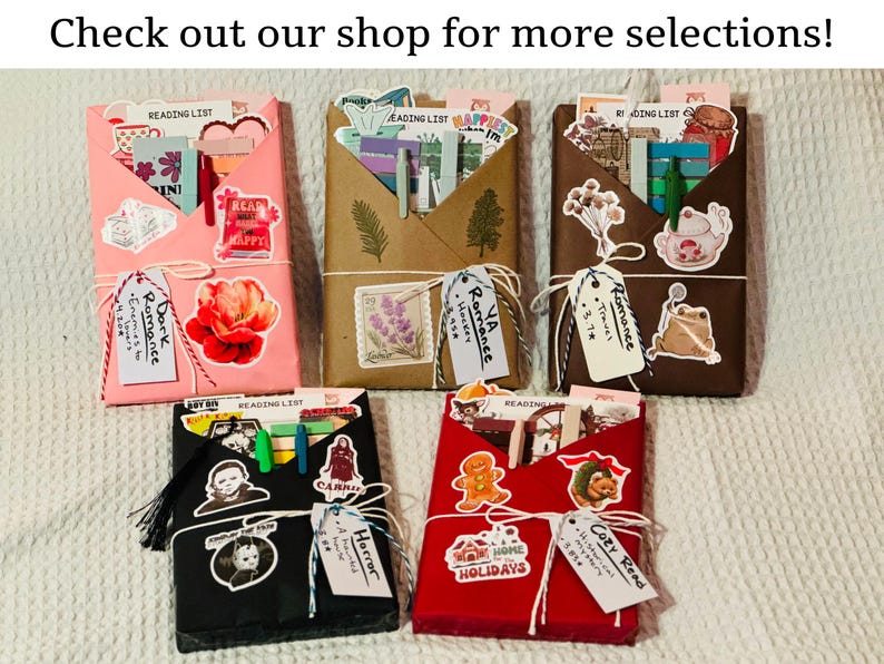 Blind date with a book assortment including pink, brown, cottagecore dark brown, spooky black, and Christmas red wrapping