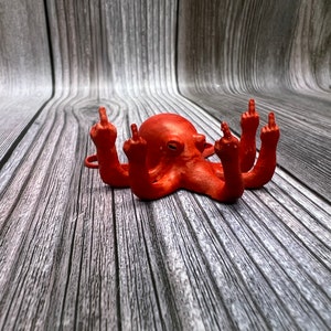 May include: A red octopus figurine with all eight tentacles giving the middle finger.