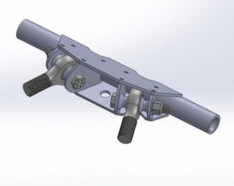 May include: A silver metal automotive suspension component with two ball joints and a metal plate. The component has two threaded rods extending from the plate.