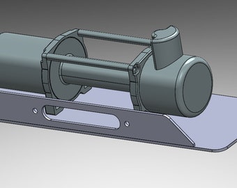 May include: A gray metal winch with a black motor and a metal base. The winch is mounted on a metal plate with a cutout in the center.