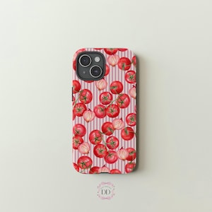 May include: A pink and white striped phone case with a pattern of red tomatoes and white onions.