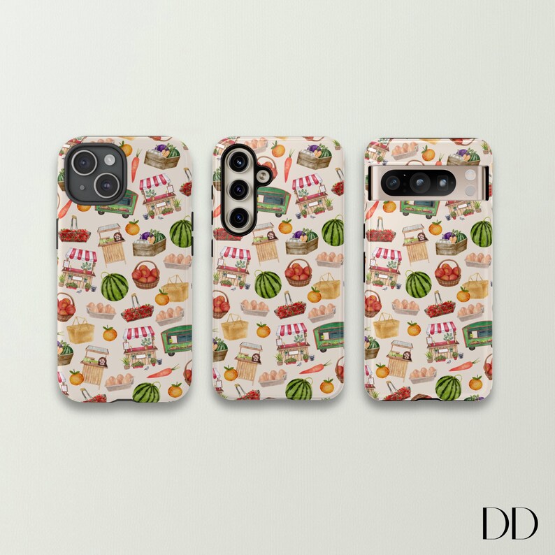 May include: Three phone cases with a repeating pattern of a farmer's market scene. The design includes green market carts, baskets of produce, watermelons, and tomatoes on a cream background. The cases are for different phone models.
