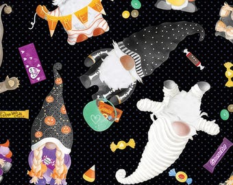 May include: A black background with white polka dots features a variety of Halloween gnomes. The gnomes are dressed in costumes such as a mummy, a skeleton, and a pumpkin. The gnomes are holding candy and other Halloween treats. The text "Trick or Treat" is featured on a banner held by one of the gnomes.