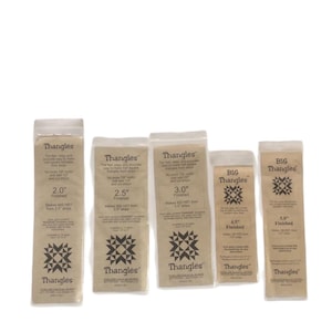May include: Five packages of Thangles, a quilting tool, are displayed. The packages are in clear plastic, with tan paper inserts. The inserts have text and a geometric design. Sizes include 2.0", 2.5", 3.0", 4.5", and 5.0" finished.