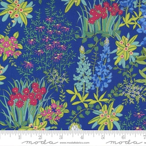 May include: A blue fabric with a floral pattern featuring pink, yellow, and green flowers. The fabric has a repeating pattern of bluebonnets, wildflowers, and other plants. The fabric is perfect for quilting, crafts, and home decor.